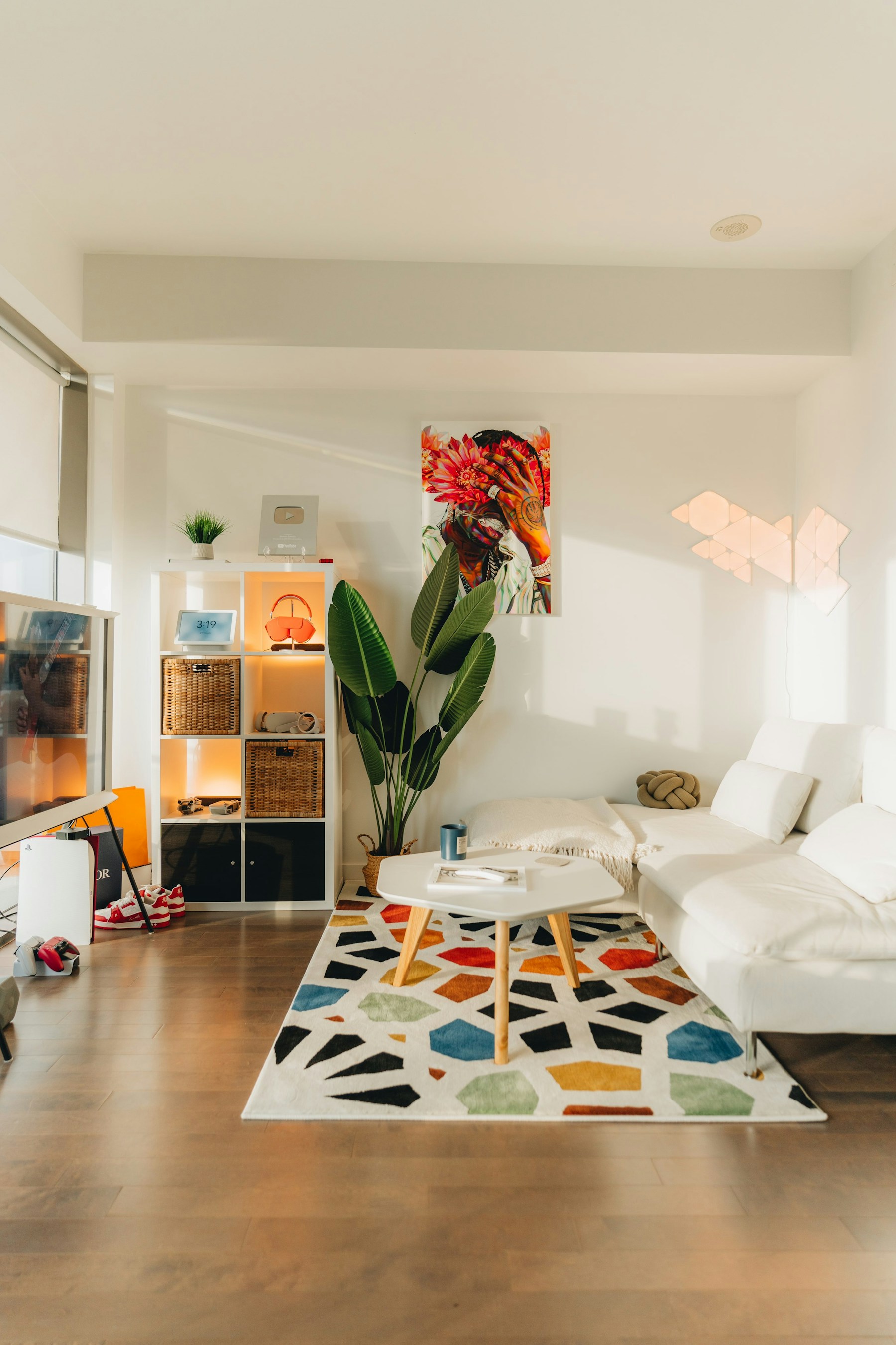 Colourful rug beside a sofa in a bright relaxed room